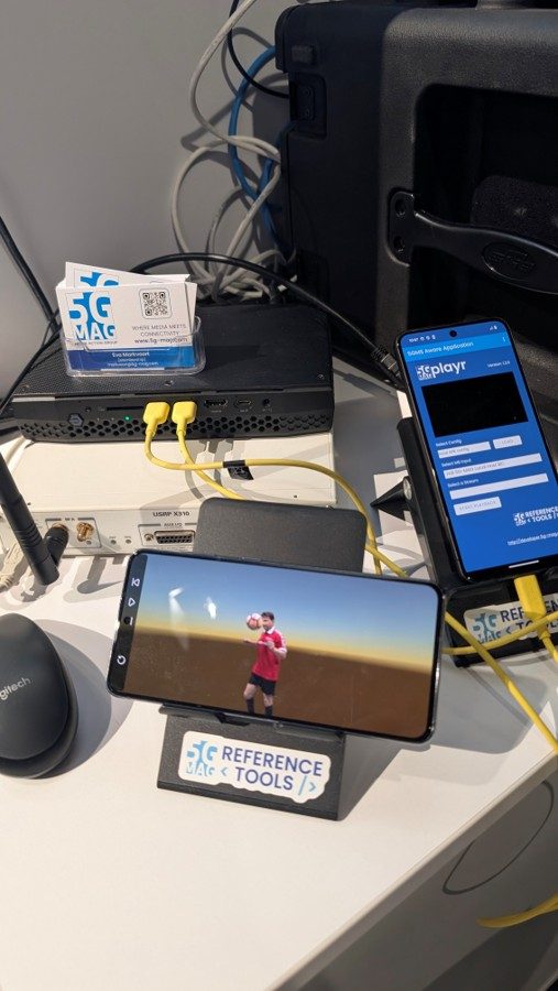 5G-MAG Reference Tools demo rig with SDR hardware and phones running 5GMS and volumetric demos